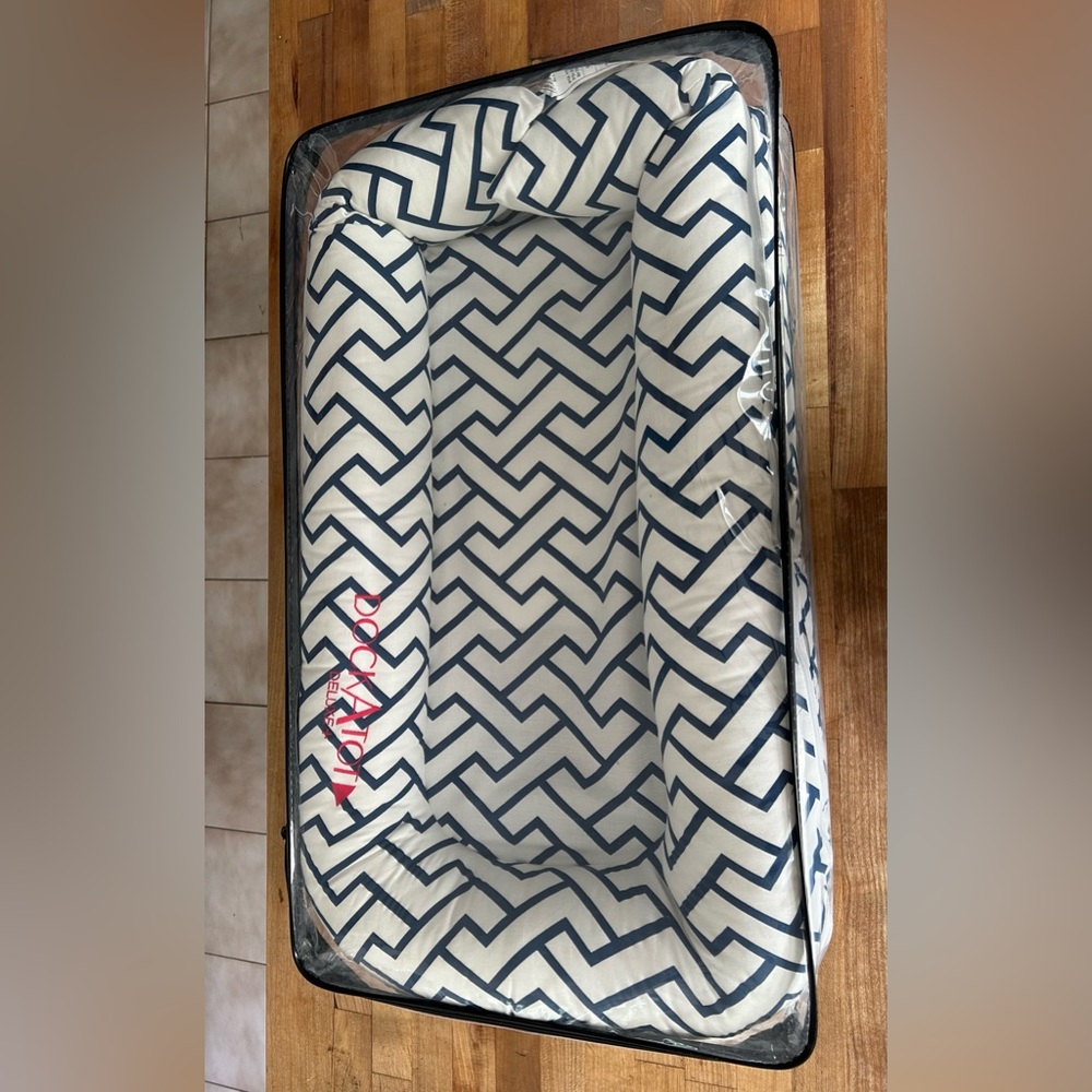 Barely used Dock-a-Tot Deluxe + baby docking station in Blue Chevron design